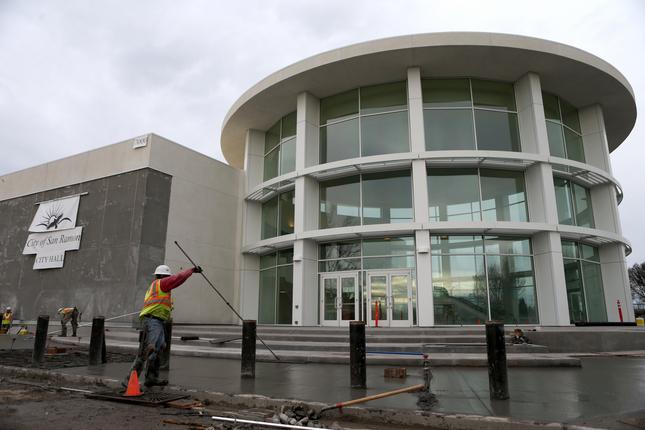 Workers lay concrete at the new San Ramon City Hall building in San Ramon, Calif., on Thursday, Jan. 28, 2016. The $14.9 million, 44,600-square-foot building is located at Bollinger Canyon Road and Market Place, and is set to open in April. (Anda Chu/Bay Area News Group)