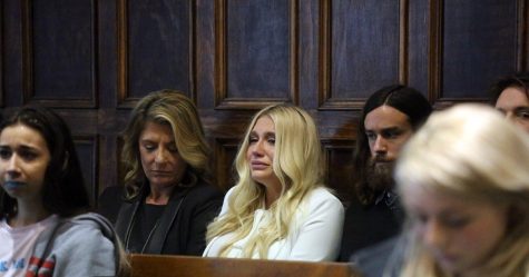 Kesha receives the news of her contract being upheld tearfully. This image quickly became iconic, representative of a watershed moment in the music industry where sexism came to light in a serious way.