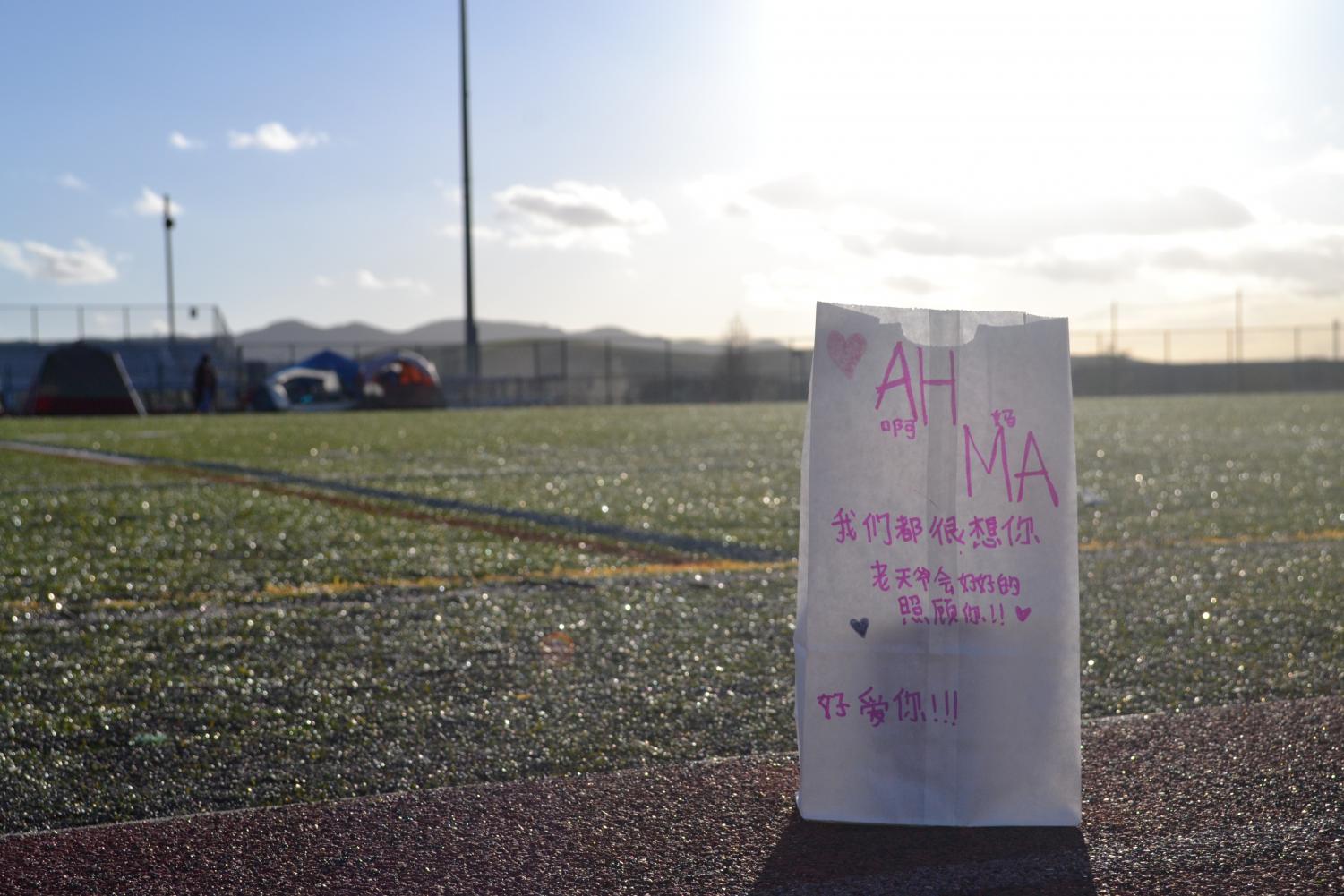 Among the Luminarias lining the field, a particular one is written in the recipient’s native language of Chinese. “Mom / We miss you so much / God will take good care of you! / We love you!” reads the pink text.