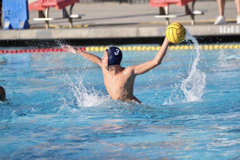 Junior Alex Burr prepares to hurl the ball into the opposing goal.