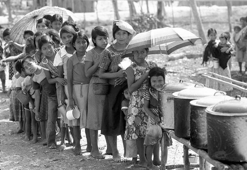 Guatemalan children living in refugee camps, in the State of Campeche, wait to get their food ration.