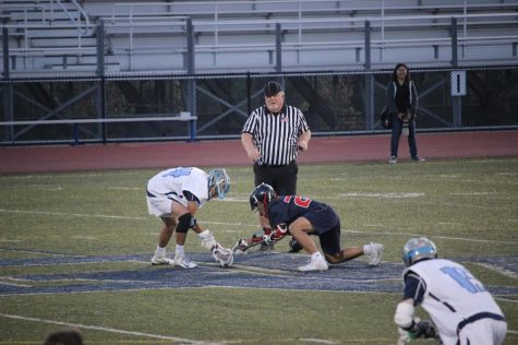 Dougherty Valley senior attacker Hudson Price faced off against a Dublin Gael at a home conference game on April 16.