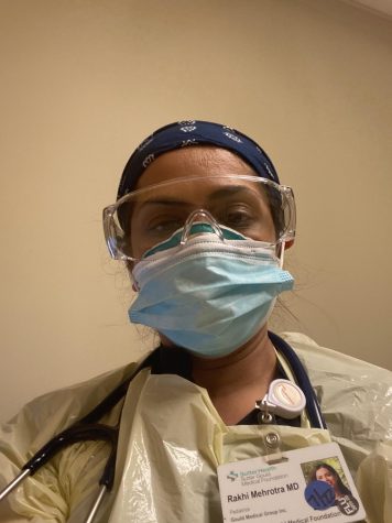 Dr. Rakhi Mehrotra wears her PPE in the Pediatric respiratory/COVID clinic at the hospital