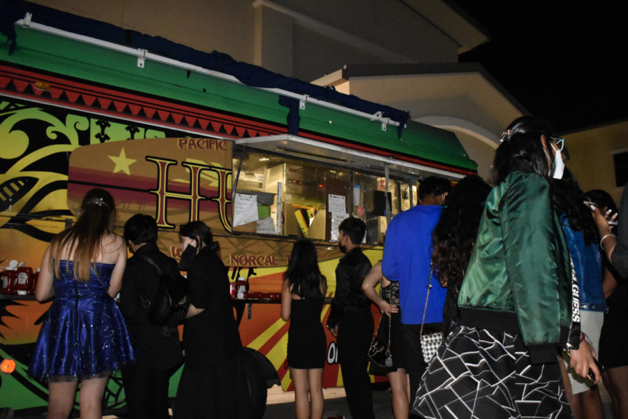 Various food trucks line the campus, offering quick bites and refreshing drinks to guests.