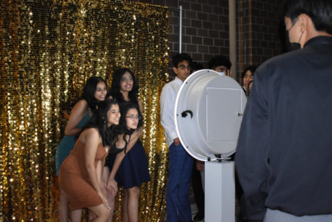 Four smiling Dougherty Valley juniors pose at the photo booth, one of the most popular attractions of the night.
