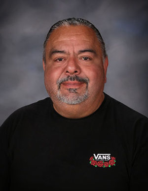 staff photo of DVHS textbook coordinator Mr. Ortiz