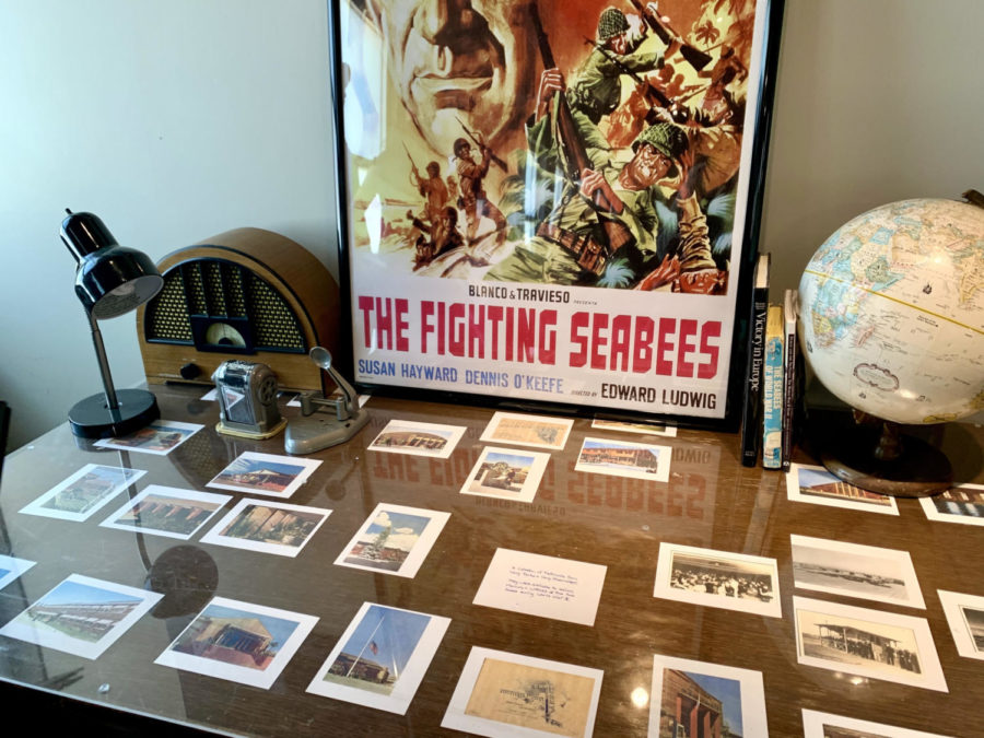 Service members, including those of the Navys Construction Battalions (Seabees), sent and received these postcards while stationed at Fleet City. The Seabees were later immortalized in the 1944 film The Fighting Seabees starring John Wayne, as shown in the framed poster.