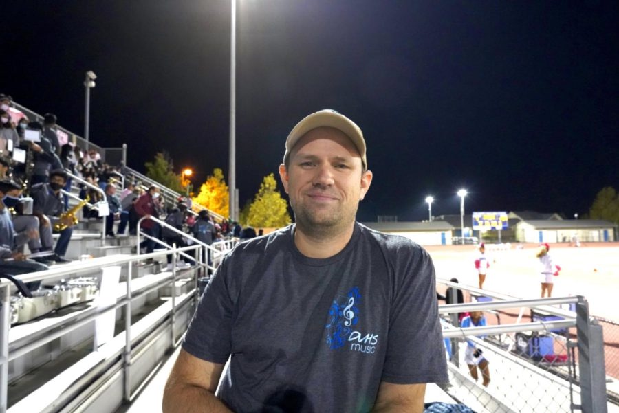 Mr. Marc Walker enjoys conducting pep band at a home football game, one of his many duties as band director.