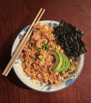 Arranged neatly with snackable sides of dry seaweed, kimchi and cut avocado, Emily Marikos Salmon Rice Bowl captivates both the eyes and the stomach.