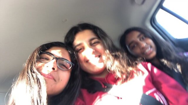 Mahika taking a selfie in a car ride with Shereen