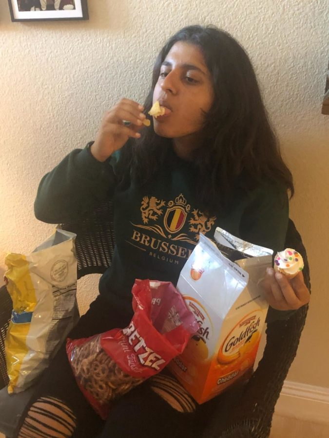 After taking a break from writing a play, Mahika was piled on top of snacks, which she calls "an experience."