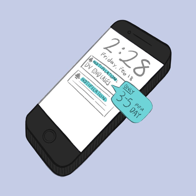 A phone which shows notifications about DV COVID case counts