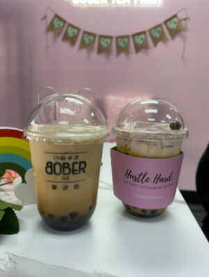 Photo of Bober Tea's brown sugar oolong on the left, pink haze drink on the right