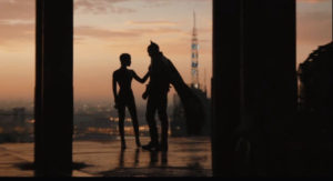 a silhouette of batman and catwomen in the middle of the movie 