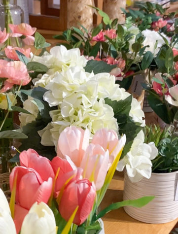 Even in stores, artificial flowers on display for purchase, where customers can decorate their homes with accents of spring.