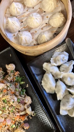 Dumpling 85 offers a variety of dishes, including vegetable dumplings, chicken xiao long bao, and shrimp fried rice.
