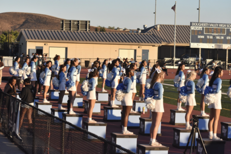 DVHS Cheer gets ready to celebrate the football team with peppy spirit and loud cheers. 
