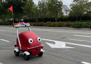 Polar Lab autonomous vehicles can be seen driving along the Dougherty Valley area with a monitoring bicyclist behind it.