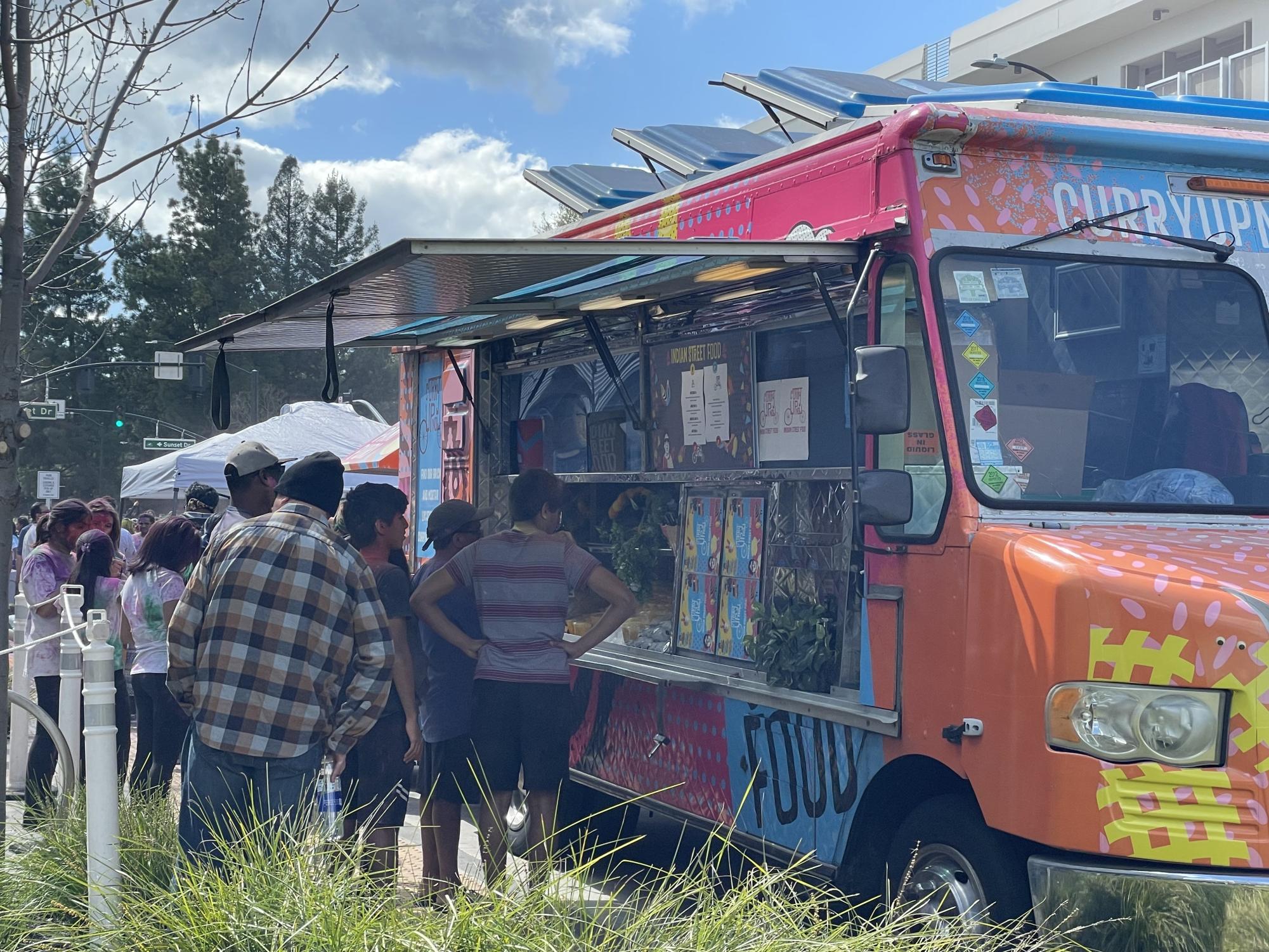 The assortment of food trucks available feature caterers such as Curry Up Now. 
