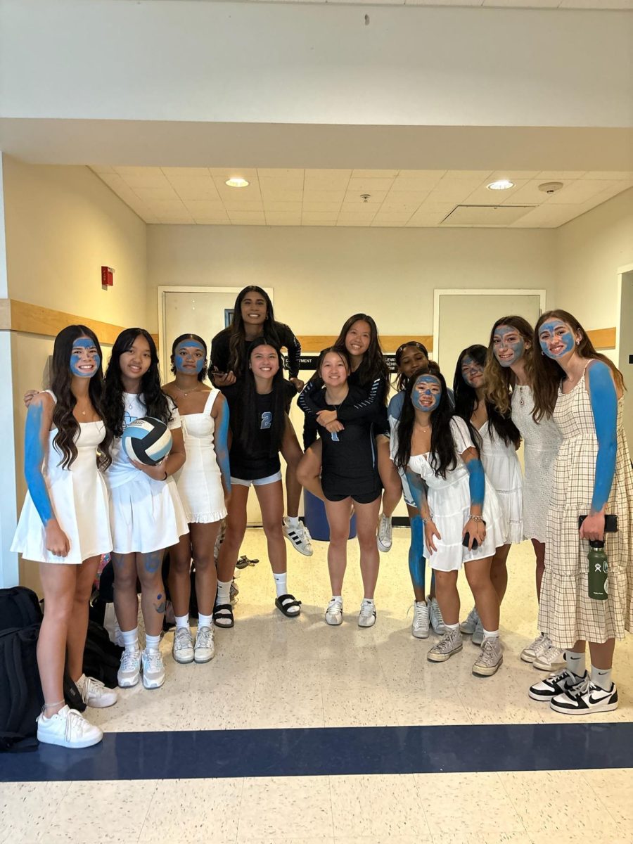 DVHS Women’s Varsity Volleyball pranks team to wear white dresses, instead of wearing blue paint.