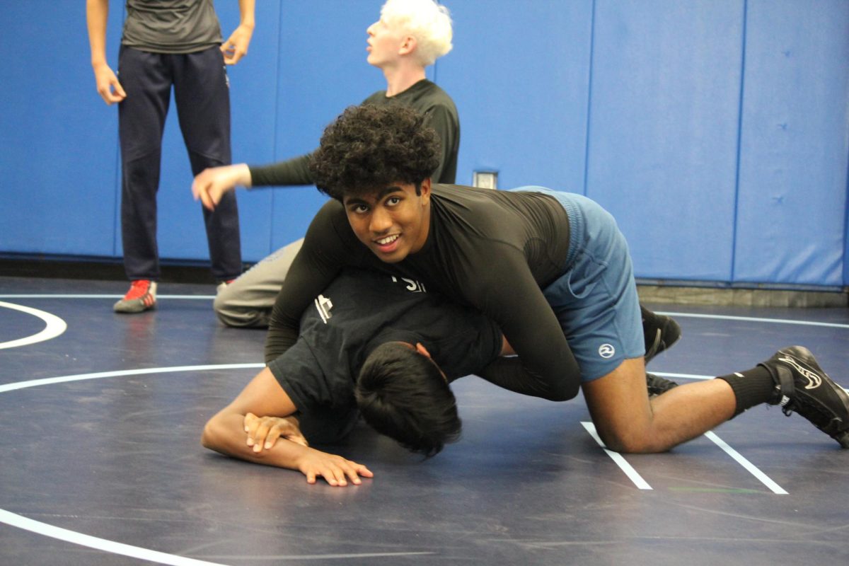 Sophomore Haureesh Vellamsetti dominates his match during offseason wrestling practice. 