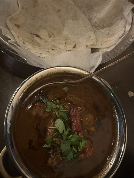 Spicy saoji chicken curry with a side of roti