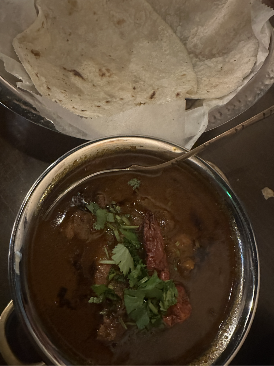 Spicy saoji chicken curry with a side of roti