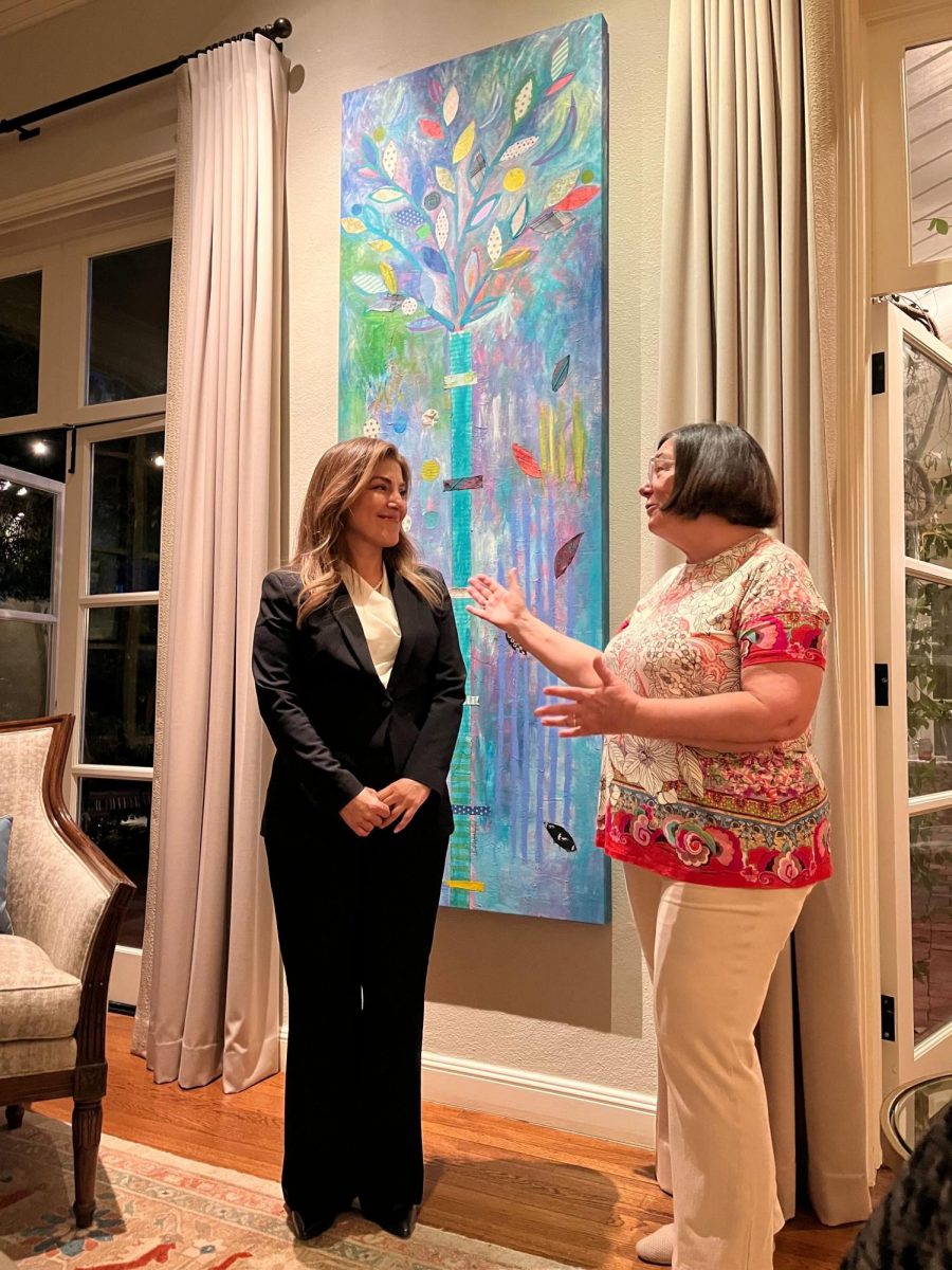 Candidate Marisol Rubio converses with the host at a gathering.