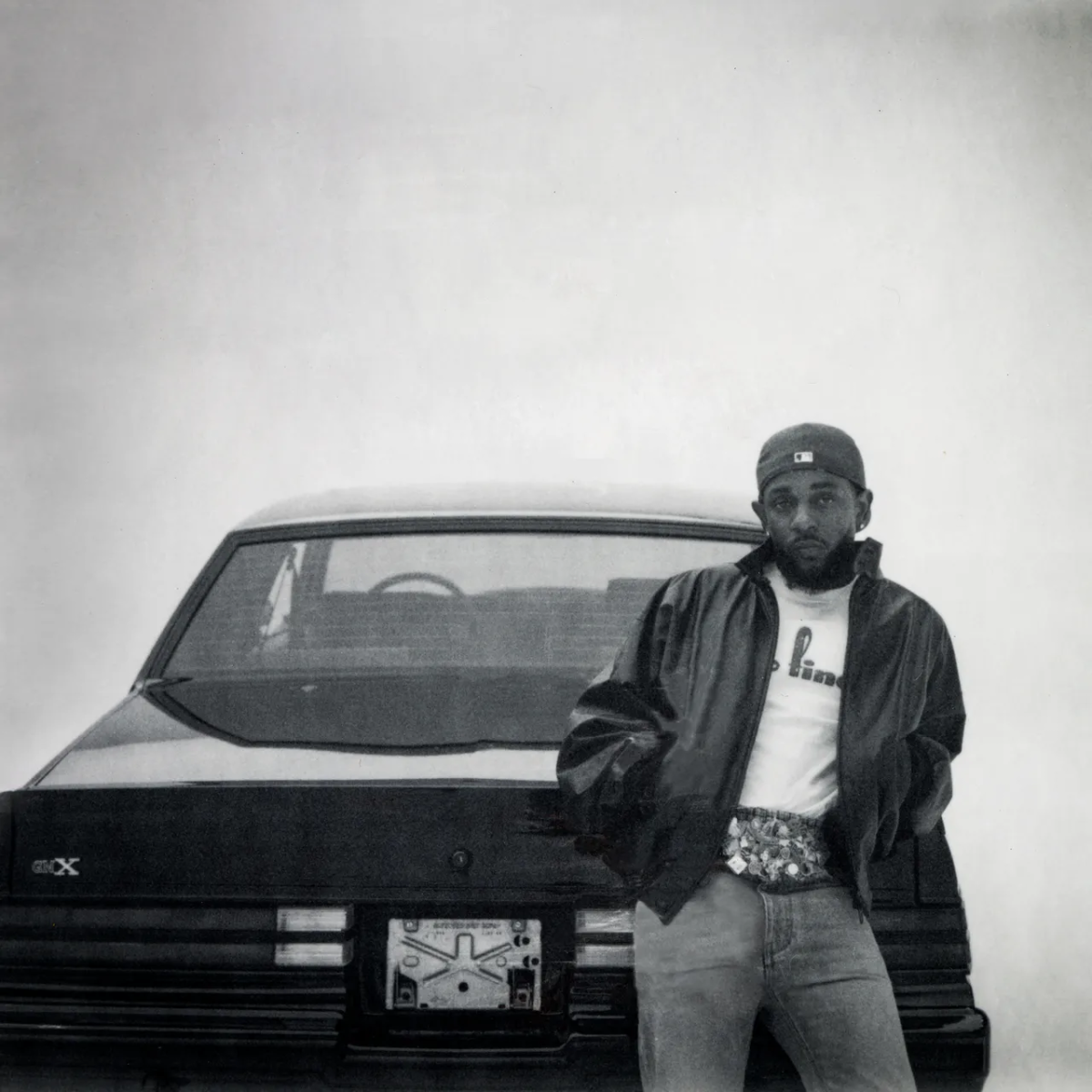 Kendrick Lamar poses in front of his Buick GNX, an icon of American culture and progress