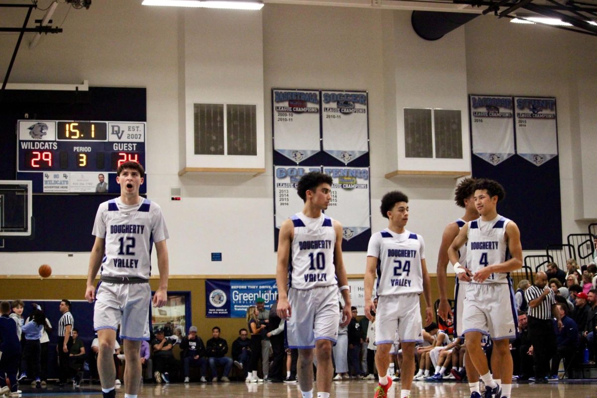  From left to right: Senior Tyler Robbins (12), senior Xayne Mojaddidi (10), senior Kenny Cloud (24) and sophomore Rylan Sevilla (4) during their game on Feb. 25 against Clayton Valley Charter High School.