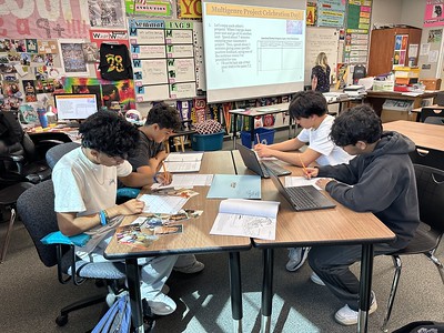 Solutionary Academy students read and reflect on each others’ projects.

