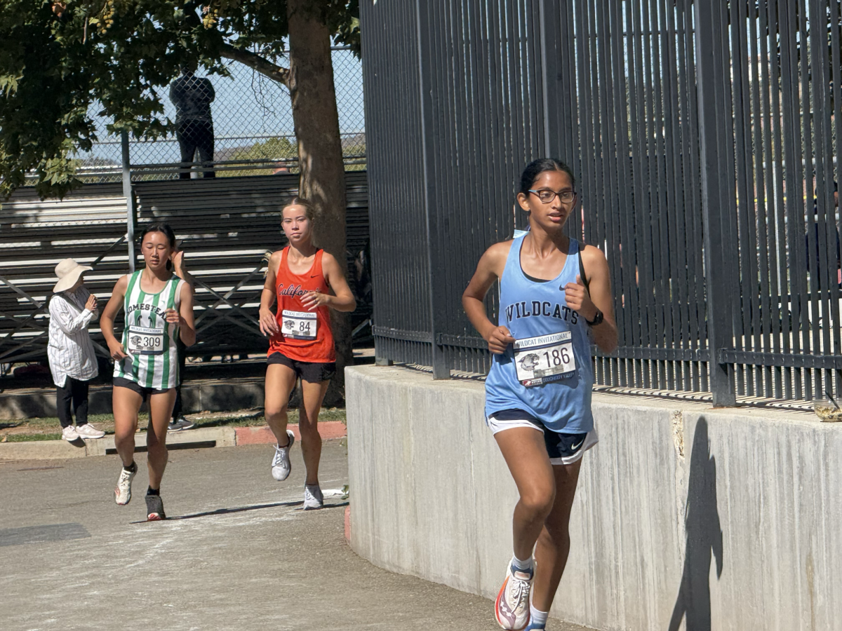 Freshman Ritika Bath competes hard at Wildcat Invitational.