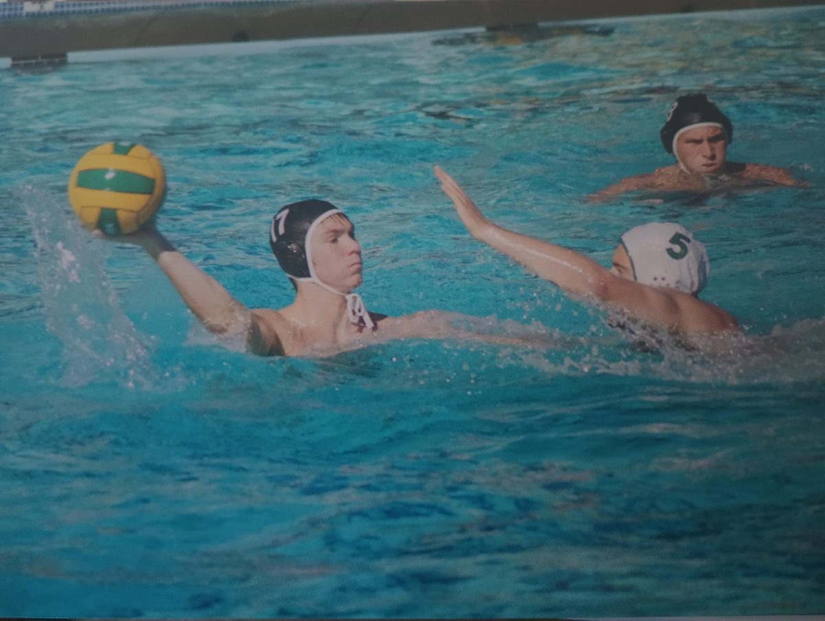 Brad Zenoni attempts a shot while playing water polo in his high school days.
