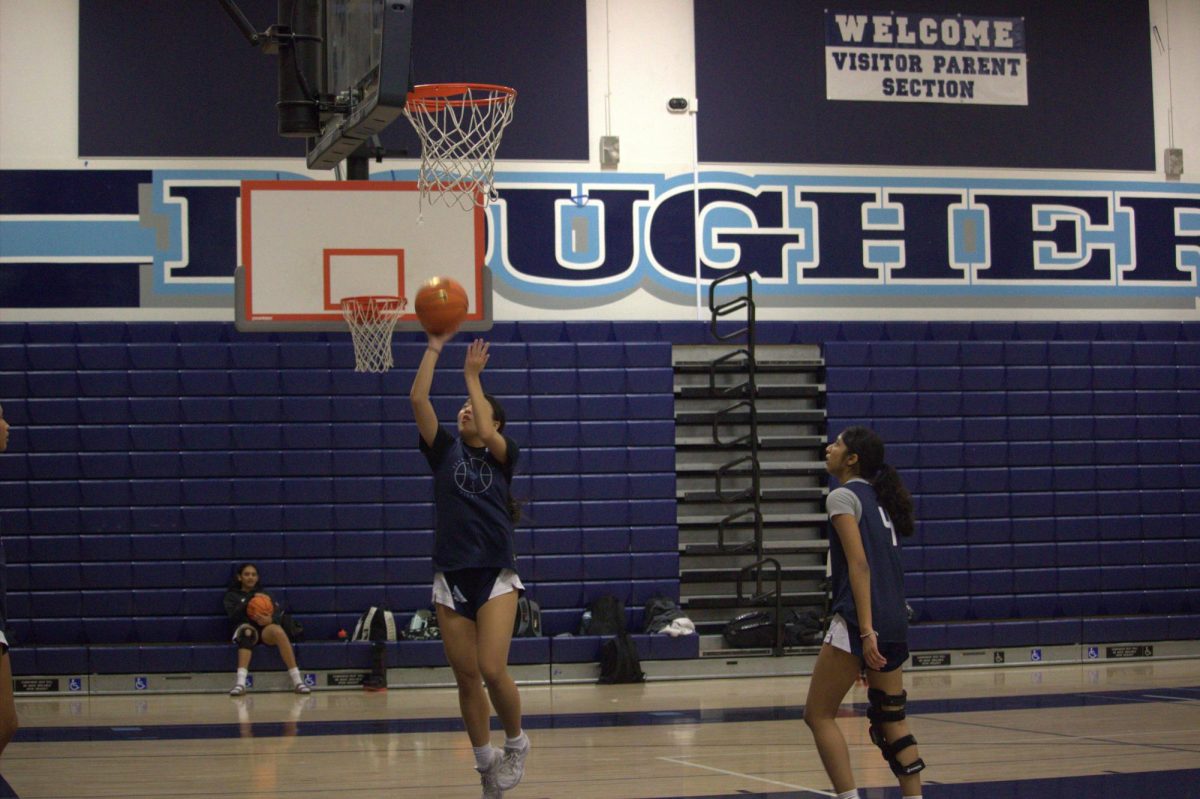 Senior Captain Kiera Tom and Guard Eesha Gujjewar warming up during practice