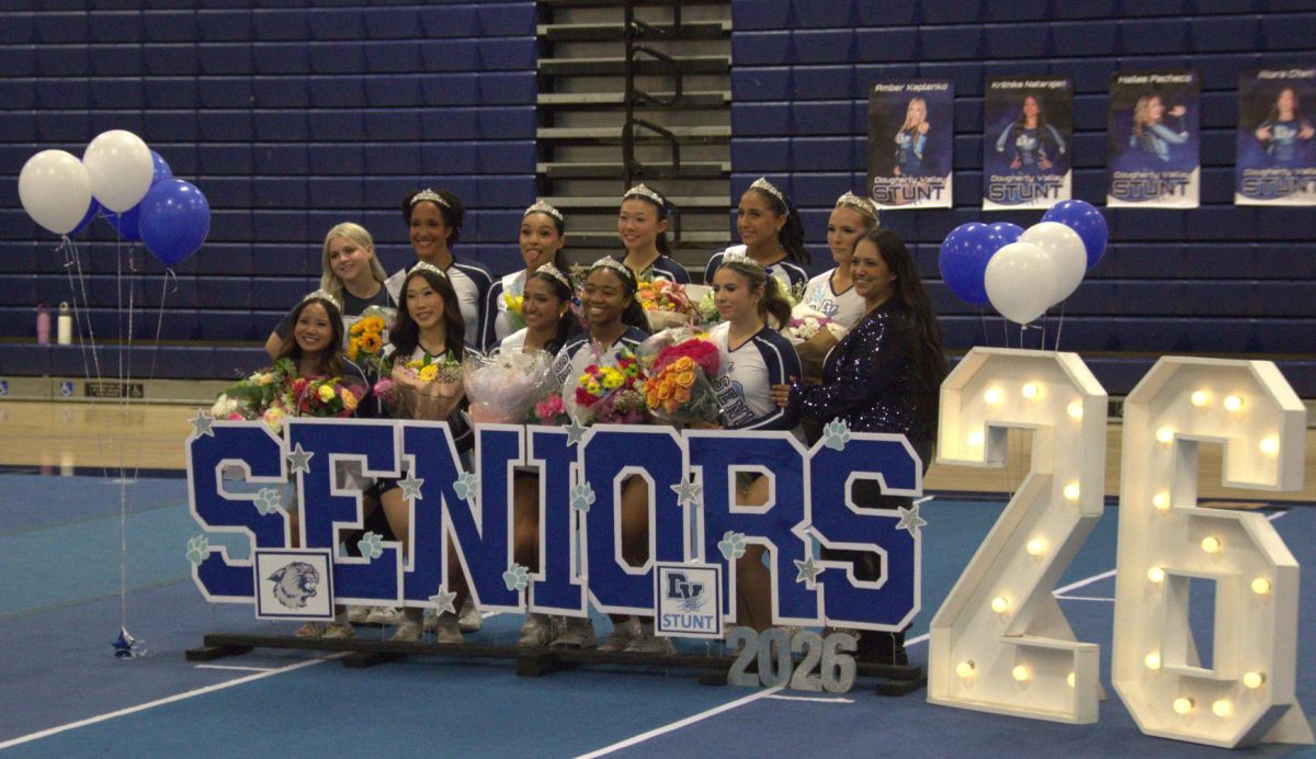  The DVHS stunt team seniors and their coaches celebrate their senior night on March 31, 2026.